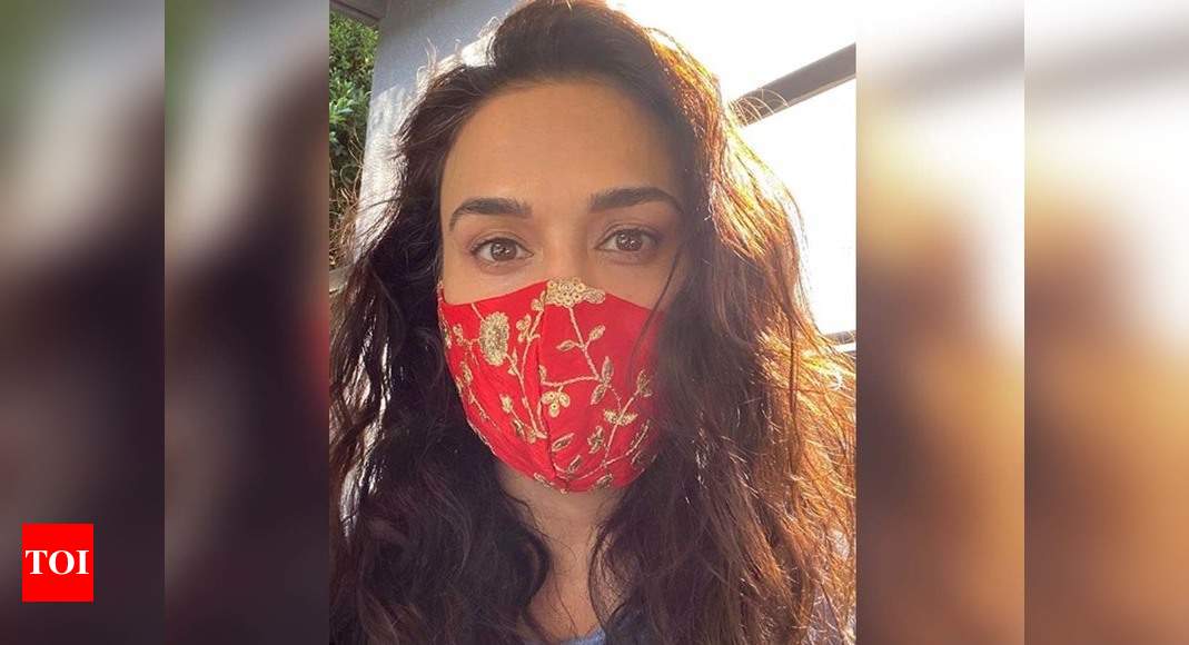 Preity Zinta poses with a designer mask; captions, "Desi vibe" | Hindi Movie News