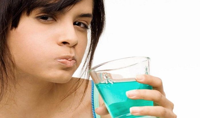 Daily Mouthwash May Cut COVID-19 Transmission Risk
