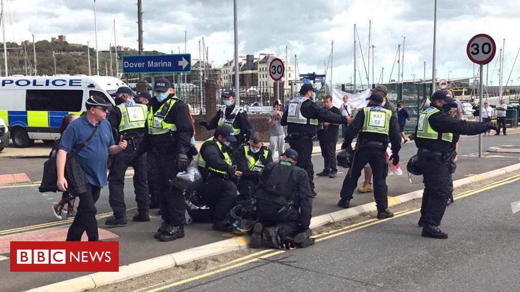 Dover police clash with immigration protesters at port