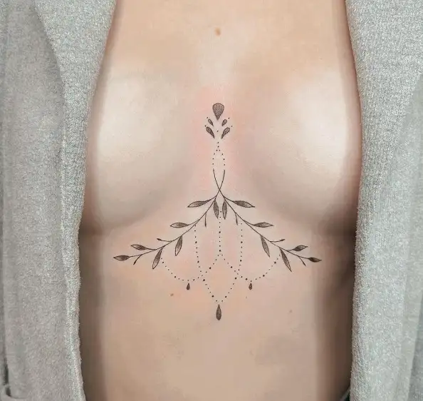 Sleek Between Breast Tattoo Designs