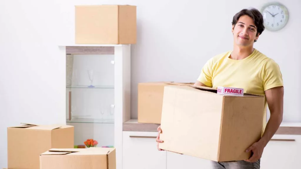 Experienced Mathura Packers and Movers team packing delicate items with precision for safe transportation.
