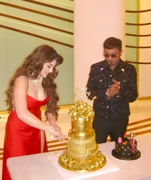 Urvashi cuts 24-carat gold cake gifted by Yo Yo Honey Singh on her b'day