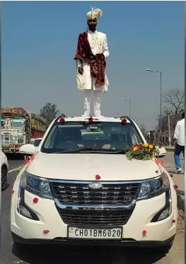 UP groom stands atop car, police seize vehicle
