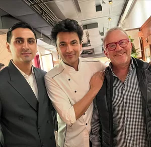 Vikas Khanna poses with 'kingmaker' Rick Smilow in his new NYC restaurant